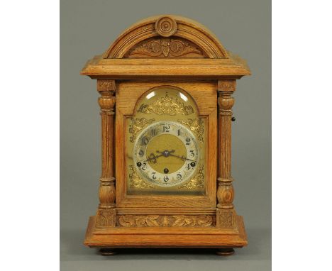 A late Victorian oak bracket clock, with three-train German movement striking on five gongs.  Height 49 cm, width 32 cm. 