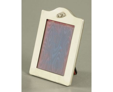 A Sterling silver photograph frame, relief moulded with horse heads, London 1987.  19 cm x 13 cm.    CONDITION REPORT:  Very 