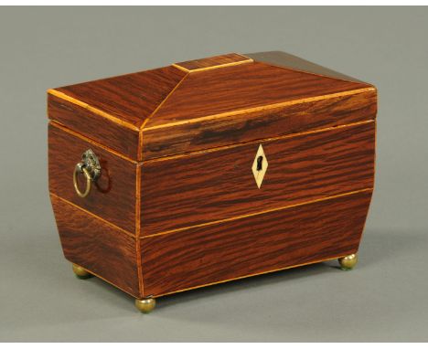 A 19th century rosewood tea caddy, raised on short brass ball feet.  Width 19 cm. 