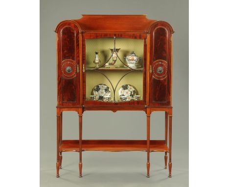 An Edwardian mahogany display case, with rear upstand, with centre glazed door flanked on either side by an arched door enclo