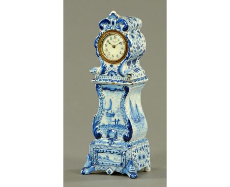 A late Victorian Delft miniature longcase clock, with American New Haven single-train movement.  Height 30 cm (see illustrati