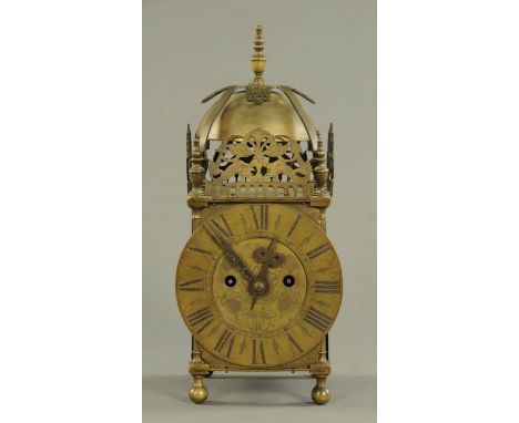 A 19th century brass lantern clock, with twin fusee movement, the dial marked "E. Baker, London".  Height 40 cm, dial diamete
