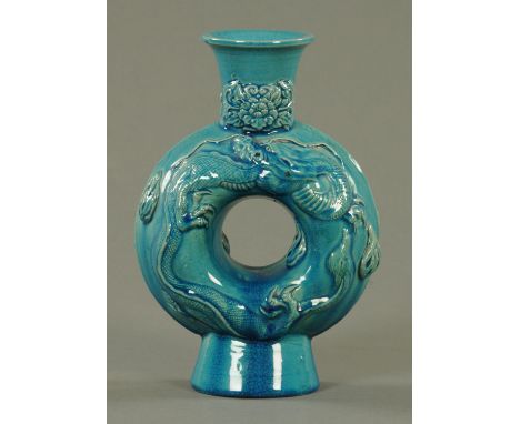 A 19th century Chinese moon flask, decorated with dragons in relief.  Height 22 cm.   CONDITION REPORT:  There is a 2.5 ins s