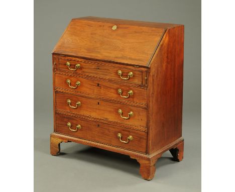 A George III mahogany bureau, with slope front, four long graduated drawers with brass swans neck drop handles and cockbeadin