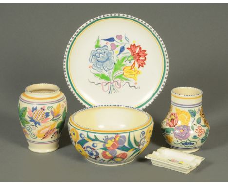 Five pieces of Poole pottery.  Plate diameter 25.5 cm. 