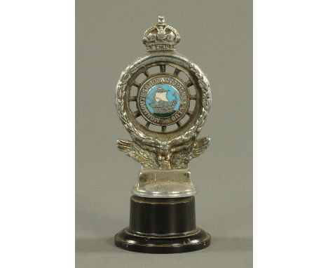 A Monmouthshire Automobile Club car mascot, raised on a composition stand.  
