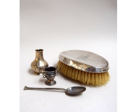 A selection of sterling silver items, comprising a comb with the monogram 'CJM', Bristol 1902, a miniature vase, Birmingham 1