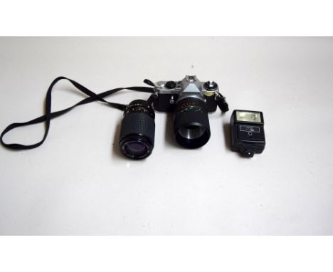 Pentax Me Super Camera with a 1:40-5.6 lens, together with a Vivitar auto 215 lamp