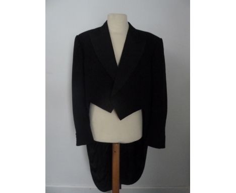 A pair of Moss Bros black evening tails with black corded silk facings, 40 inch chest; and a Moss Bros two piece black dinner