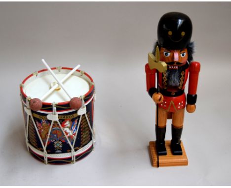 Wooden Nutcracker soldier, together with a replica military drum from Scots Guards Ice Bucket, produced as an ice bucket
