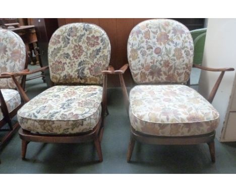 A pair of 1950s Ercol armchairs with removable floral cushions 69 x 80cmH