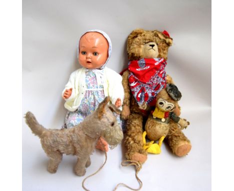 A selection of vintage toys, to include Donald Duck, a doll, teddy bear, together with a small dog