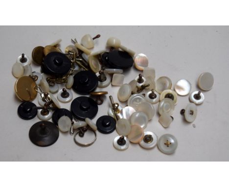 A collection of buttons, to include a quantity of mother of pearl shank buttons, together with others in black pastic and gil