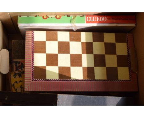 A selection of vintage board games including Cluedo and chess amongst others