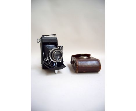 A Zeiss Ikon folding camera with Compur Rapid Nettar- Anastigmat lens together with a Kodak Coloursnap 35 both in leather car