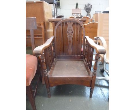 A small tripod table with marble top together with a low early 20th century wooden armchair