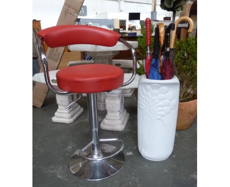 A chrome and red leatherette bar stool together with a ceramic umbrella stand filled with walking sticks and umbrellas