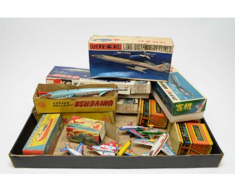 A quantity of boxed and unboxed scale model tinplate aircraft, including: passenger rockets, a Friction rocket, a Friction lo