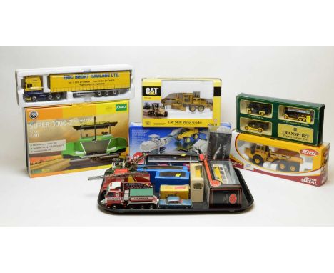 Boxed scale model vehicles, including: Vogele Super 3000-2 Tracked Paver, 1:50 scale, and Norscot Cat 140H Motor Grader, 1:50