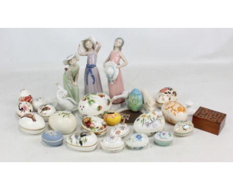 Three Lladro figures of young girls, three Lladro geese and a collection of ceramic trinket boxes.