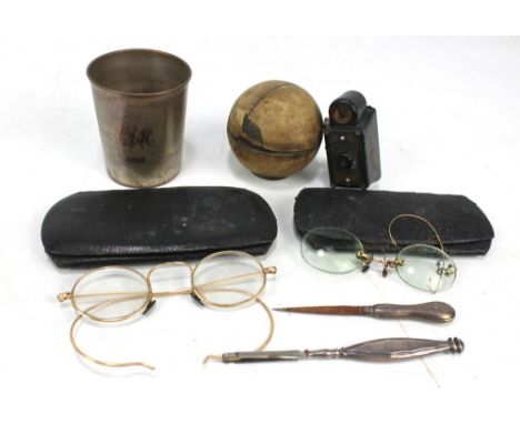 A small group of collectors' items including two cased pairs of spectacles, inkwell modelled as a cricket ball, Coronet Midge