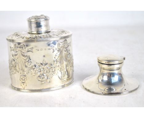 NATHAN &amp; HAYES; a Victorian hallmarked silver tea caddy of oval form with embossed floral garlands, Birmingham 1893, heig