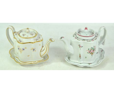 Two late 18th/early 19th century New Hall porcelain teapots, covers and stands, both painted with floral sprays, the first in