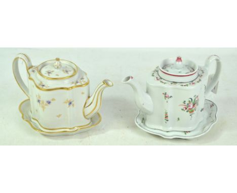 Two late 18th/early 19th century New Hall porcelain teapots, covers and stands, both painted with floral sprays, the first in