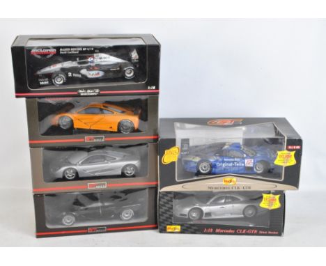 Six boxed 1:18 scale model vehicles comprising Minichamps McLaren Mercedes MP4/14 David Coulthard, three UT Models McLaren ro