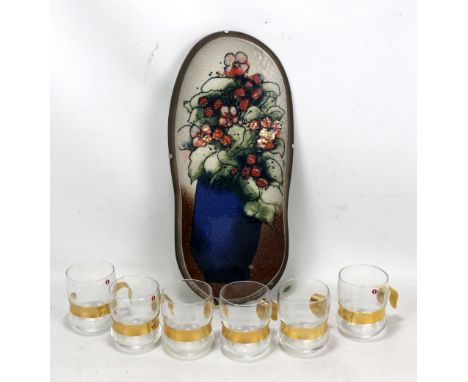 A shaped ceramic plaque depicting vase of flowers signed Helja Lukko-Sundstrom '86 for Arabia Finland, length 39.5cm, and six