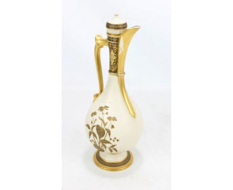 A Royal Worcester footed bottle shaped ewer with gilt handle and floral and foliate moulded neck, painted with floral sprays,