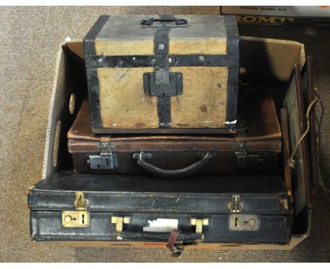Two sepia prints of Cairo, a watercolour portrait sketch, two leather attaché cases and a small canvas bound box. 