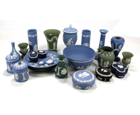 A group of Wedgwood jasperware including vases, plates, candlestick, lidded trinket boxes, two brooches, etc. 