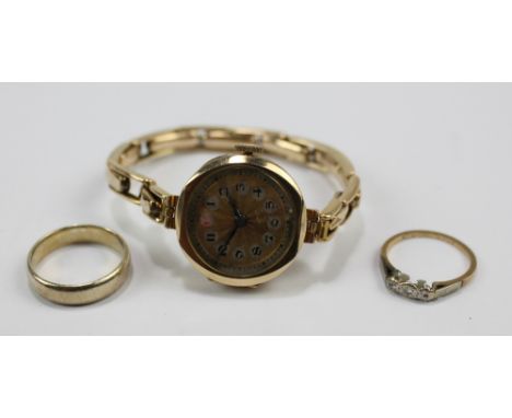 An early 20th century 9ct yellow gold cased mechanical lady's wristwatch, the circular engine turned decorated dial set with 