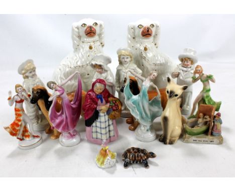 Various ceramic figures to include a pair of Staffordshire type spaniels, an Arcadian China 'Market Woman' figure, a 'Did You