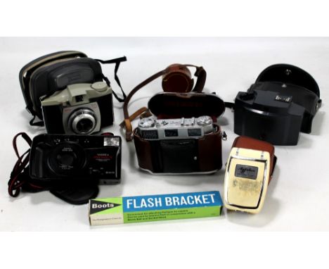 A small group of cameras and related equipment including Kodak Retina IIIC, Agfalux, flash bracket etc.