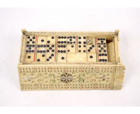 An early 19th century French Prisoner of War (probably) carved bone domino set comprising thirty-six dominoes, a single small