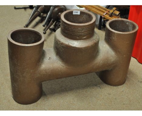 An unusual terracotta glazed three section pipe collar, now ideal for use as a garden planter or rhubarb forcer, width 72cm.