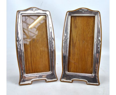 JOSEPH GLOSTER LTD; a pair of Edward VII hallmarked silver fronted Art Nouveau photo frames embossed with lily of the valley 