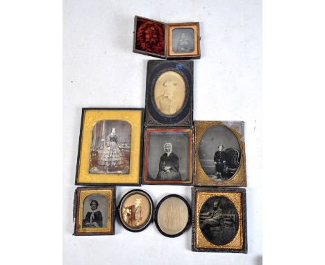 A group of Victorian photographs and an ambrotype depicting a boy beside an armchair in oval, 9.5 x 5cm (8).