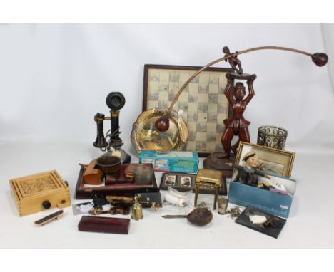 A mixed group of collectors' items including candlestick telephone, chess board, terracotta oil lamp, papier-mâché plate with