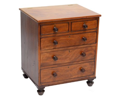 A 19th century mahogany chest commode, the baize lined interior with enamel bowls, set with two short over three long faux dr