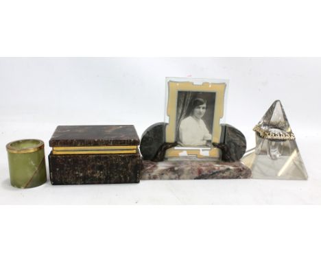 A French marble photo frame decorated with dogs' heads, a brown onyx box, a green onyx jar and a clear glass pyramid shaped i