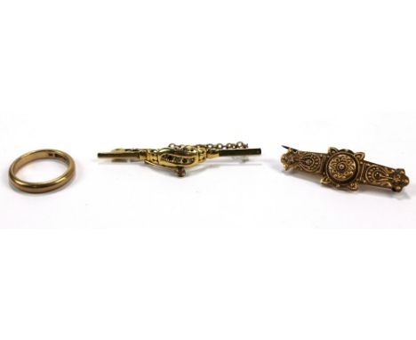 A Victorian yellow metal bar brooch set with diamond and ruby chips, width 5cm, a further 9ct gold example and a wedding band