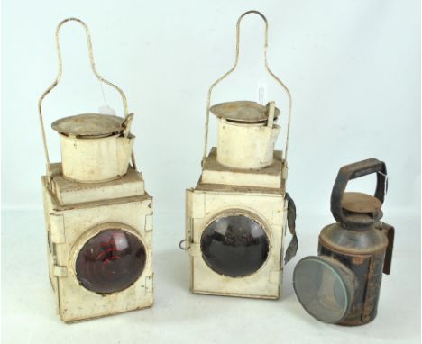 A pair of white painted British Railway lamps and a smaller BR lamp (3).  CONDITION REPORT: All heavily worn with significant