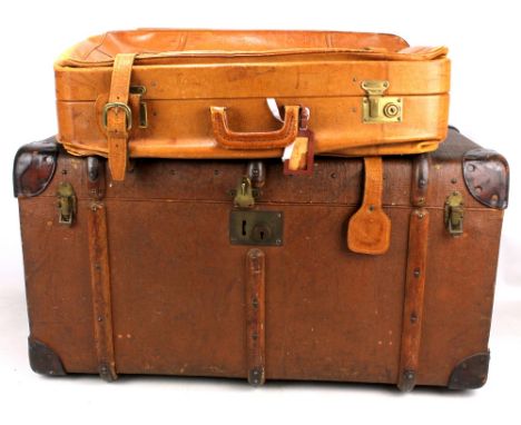 A wooden banded travelling trunk initialled 'C.L.W.' to sides and a leather suitcase (2). 