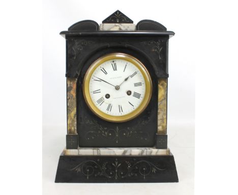 A late 19th century black slate and marble detailed mantel clock, the circular white enamel dial set with Roman numerals, ins