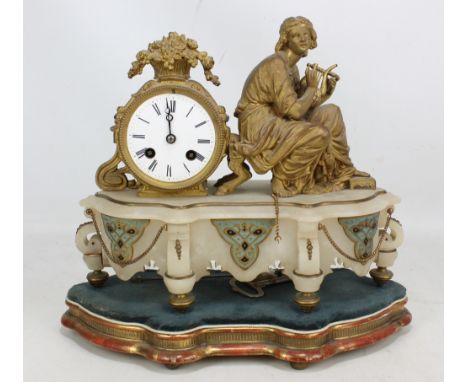 A late 19th century French alabaster and gilt spelter mantel clock with drum type eight day movement and raised on a shaped g