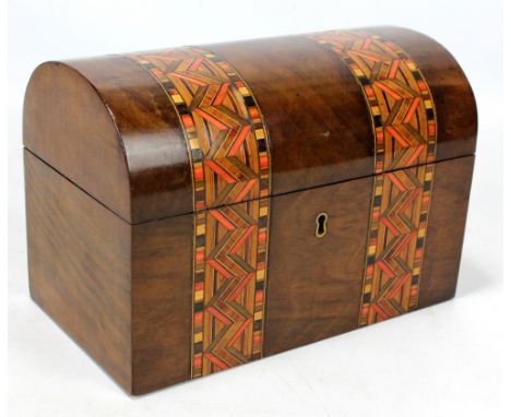 A Victorian walnut and inlaid tea caddy with domed hinged lid, width 23cm, lacking key.