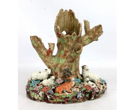 A 19th century Staffordshire animal figure group of four sheep and a stag, three of the sheep with painted 'W' to their backs